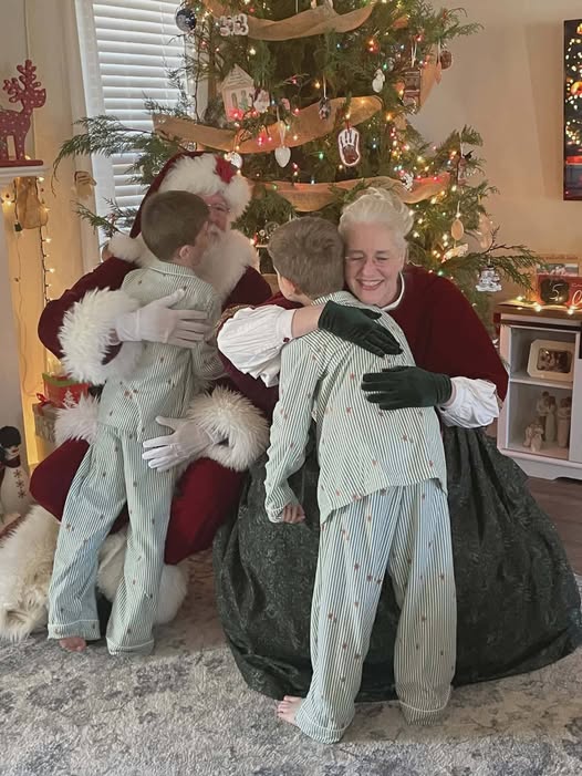 Santa and Mrs. Claus sharing a meaningful moment with children during a Christmas visit
